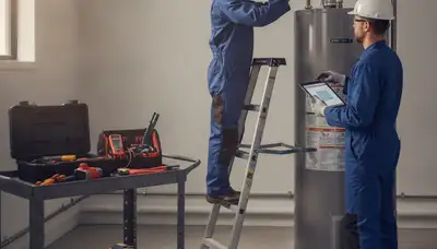Milwaukee, WI plumber repairing a water heater for reliable home service on a cold winter day
